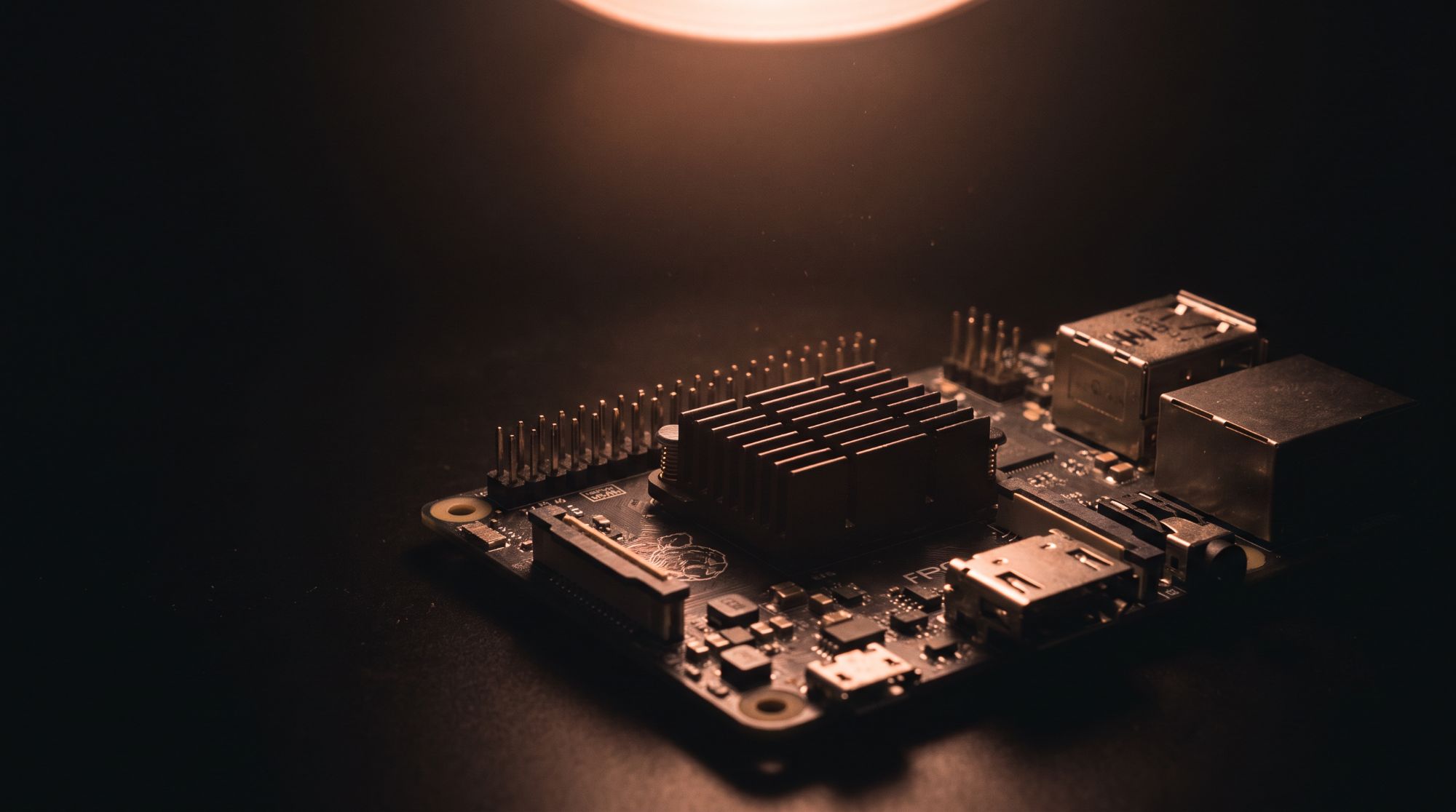 Conceptual render: a single FPGA development board lit by a warm copper light.